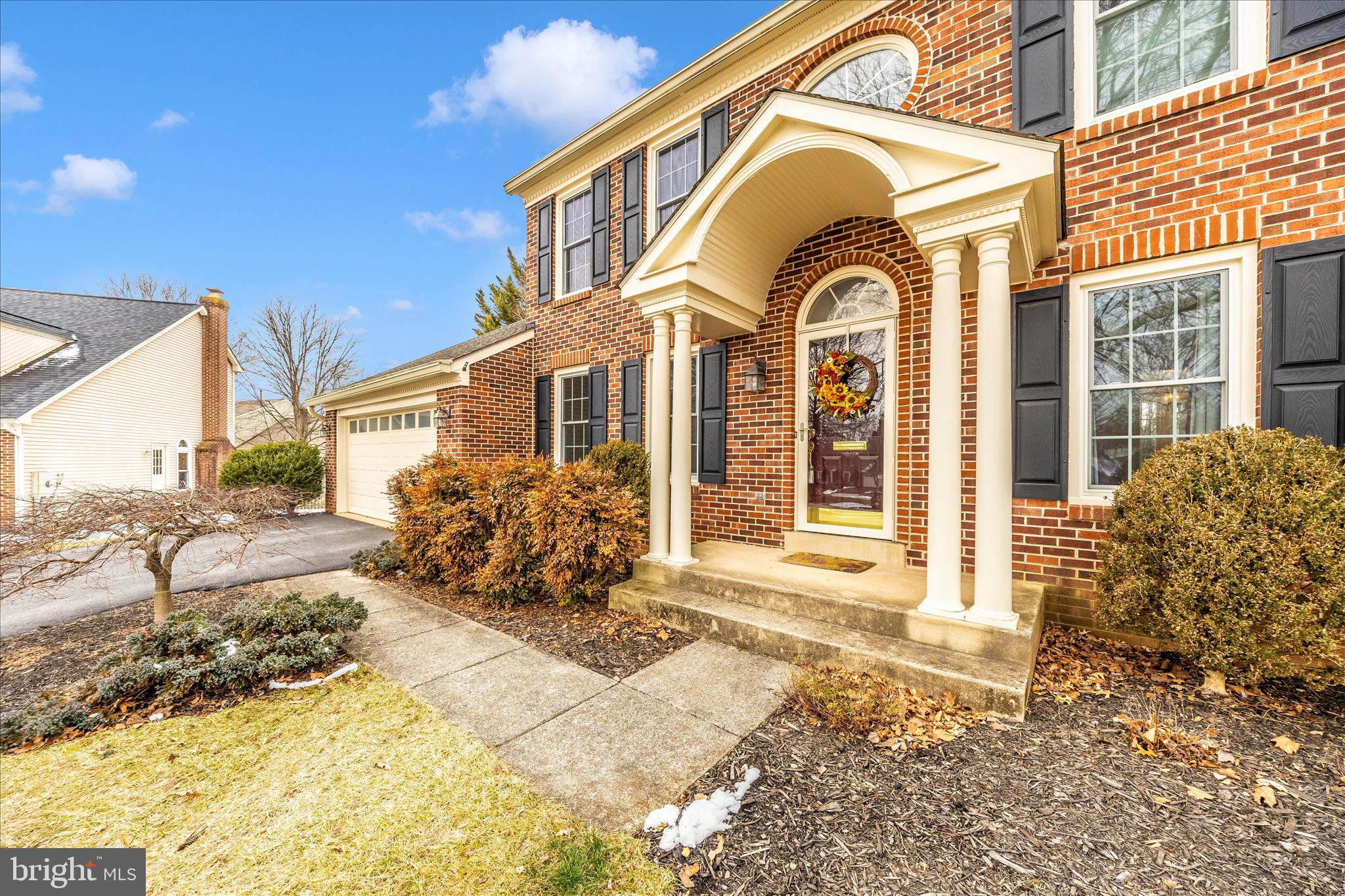 6135 Cornwall Place Frederick, MD 21701 - Photo 50 of 81 a front view of a house with garden