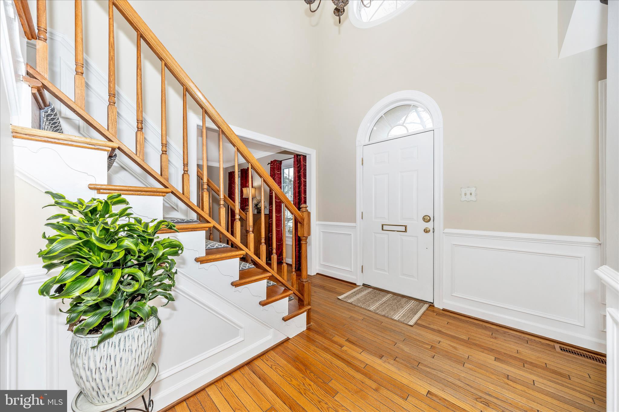 6135 Cornwall Place Frederick, MD 21701 - Photo 5 of 81 a view of staircase with wooden floor and a potted plant