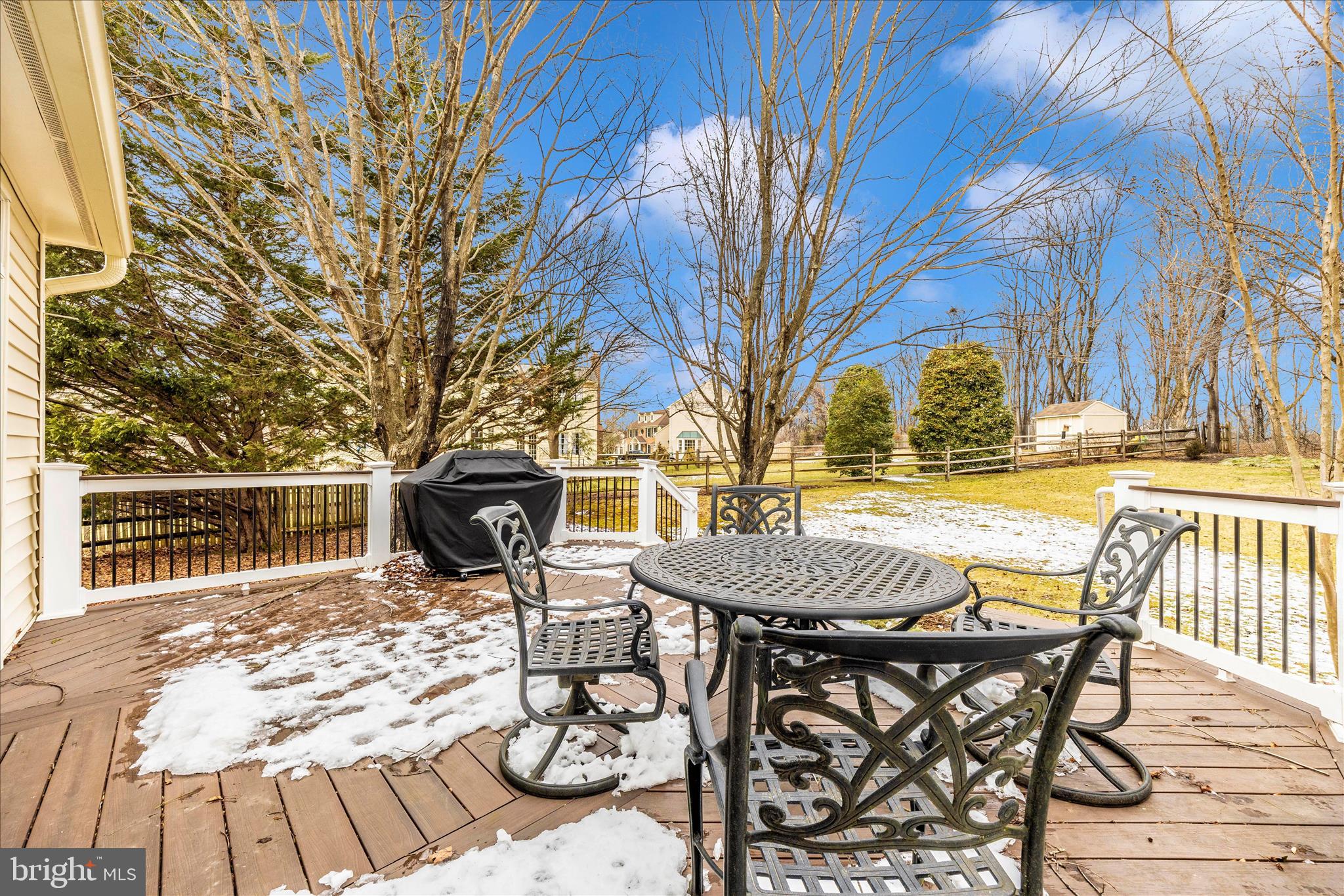 6135 Cornwall Place Frederick, MD 21701 - Photo 58 of 81 a view of a patio with table and chairs with wooden floor and fence