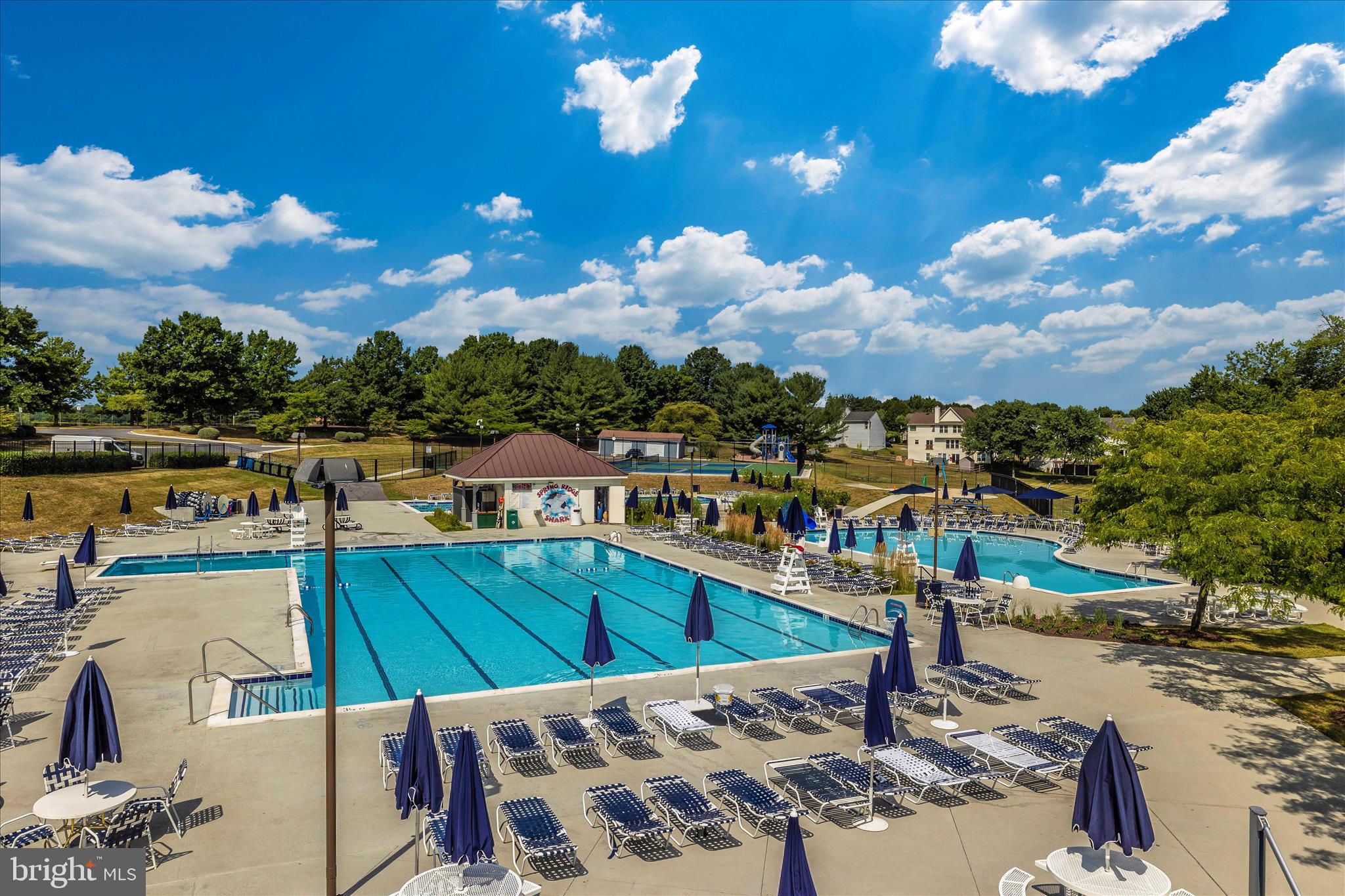 6135 Cornwall Place Frederick, MD 21701 - Photo 65 of 81 a view of a swimming pool with a table and chairs