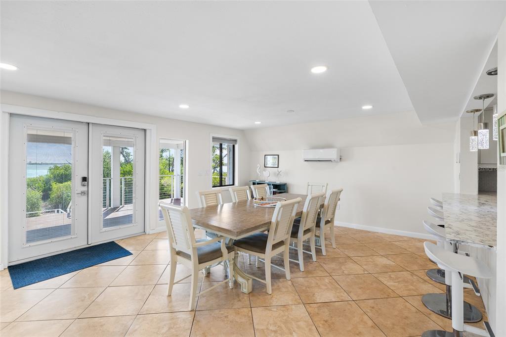 9664 Privateer Road Boca Grande, FL 33921 - Photo 12 of 66 a view of a dining room with furniture and wooden floor