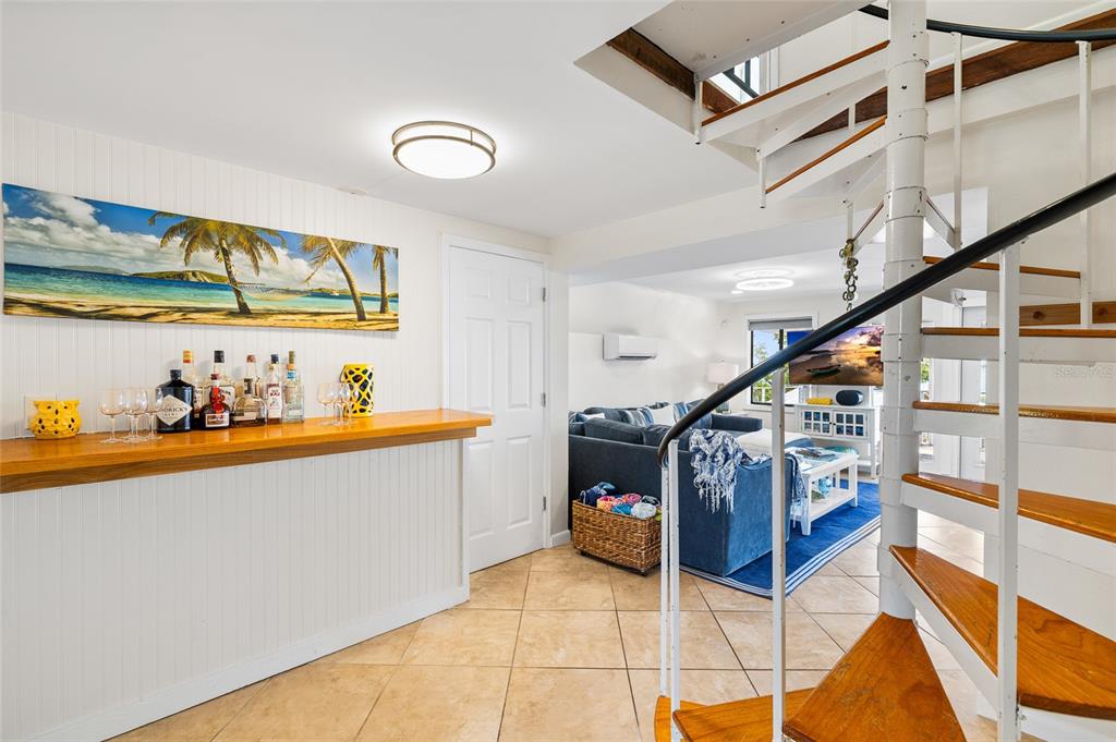 9664 Privateer Road Boca Grande, FL 33921 - Photo 15 of 66 a very nice looking room with wooden floor and furniture