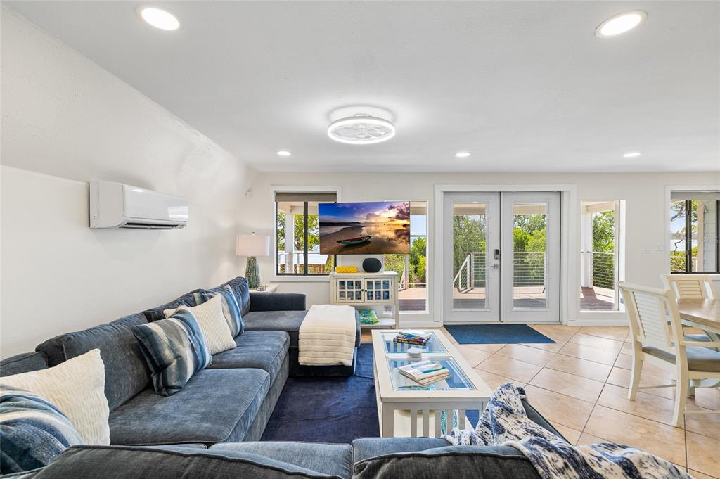 9664 Privateer Road Boca Grande, FL 33921 - Photo 16 of 66 a living room with furniture and a flat screen tv