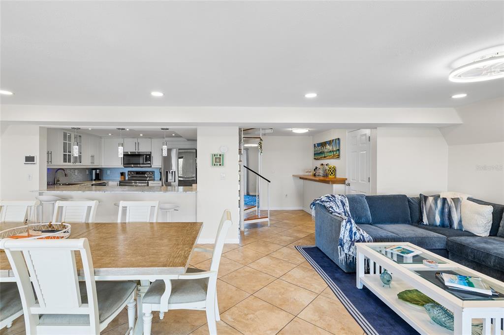 9664 Privateer Road Boca Grande, FL 33921 - Photo 2 of 66 a living room with furniture and a dining table with kitchen view