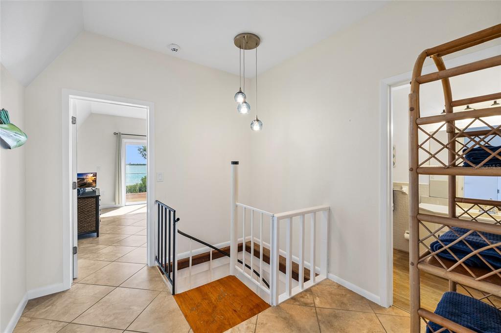 9664 Privateer Road Boca Grande, FL 33921 - Photo 26 of 66 a very nice looking room with a dining table a mirror and a window