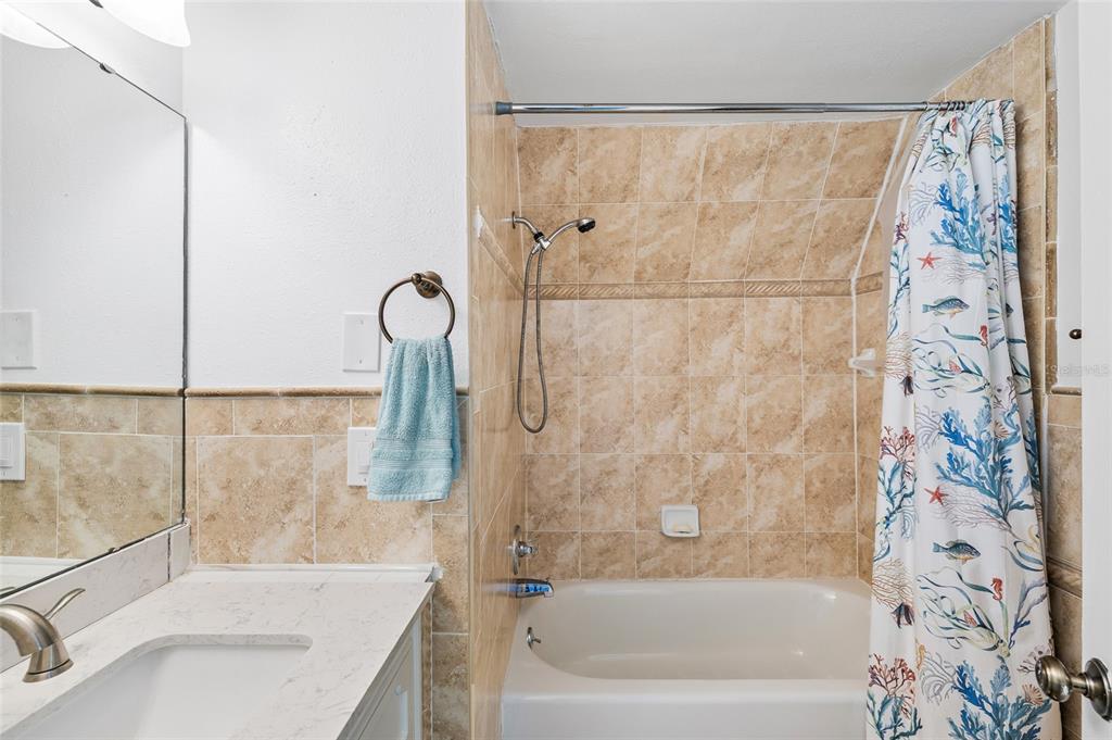 9664 Privateer Road Boca Grande, FL 33921 - Photo 32 of 66 a bathroom with a sink and a bathtub