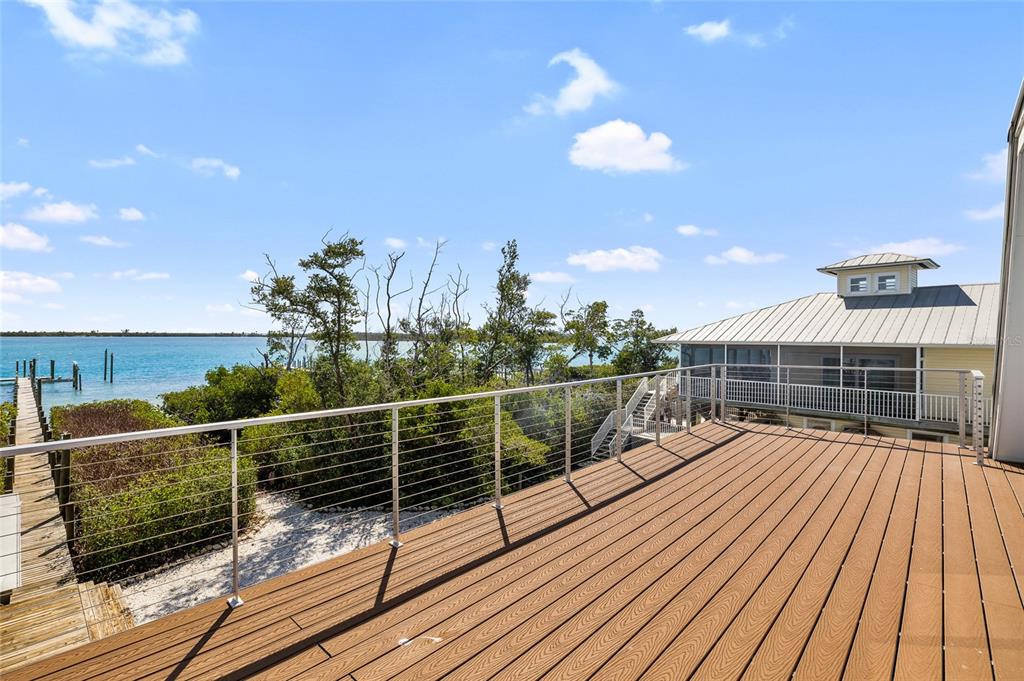 9664 Privateer Road Boca Grande, FL 33921 - Photo 33 of 66 a view of balcony with wooden floor and fence