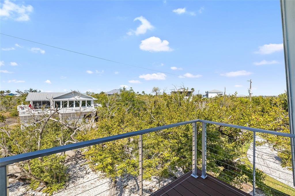 9664 Privateer Road Boca Grande, FL 33921 - Photo 34 of 66 a view of a balcony with city view