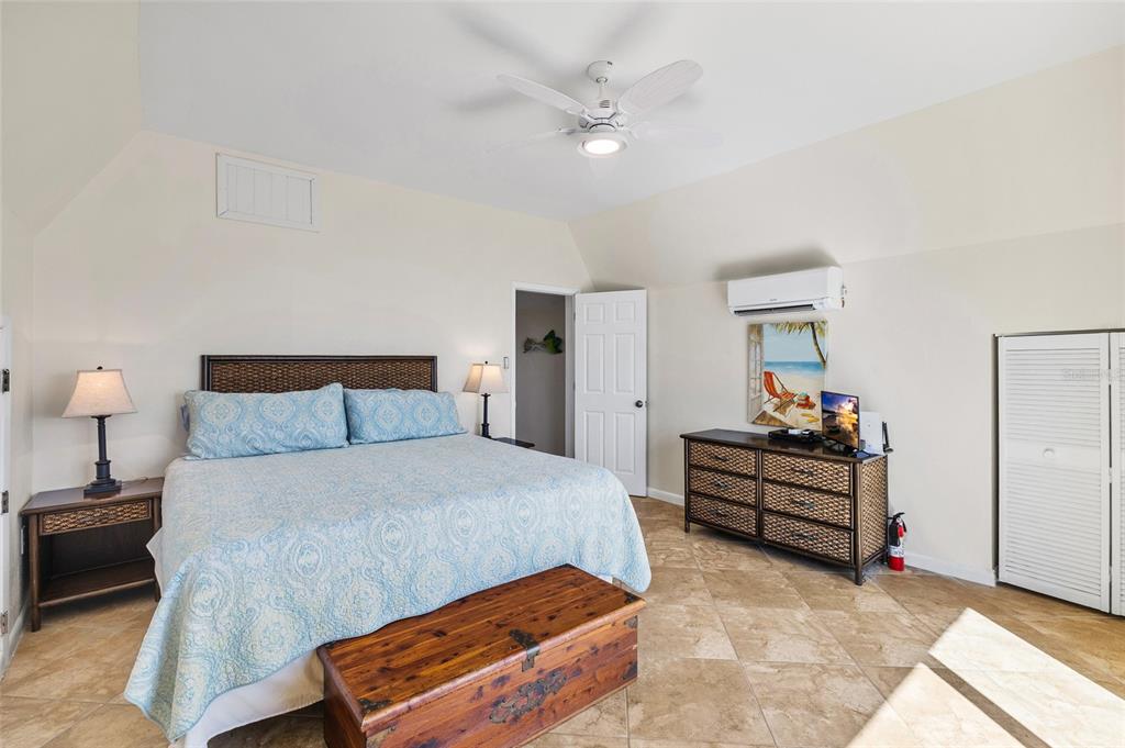 9664 Privateer Road Boca Grande, FL 33921 - Photo 37 of 66 a bedroom with bed and window