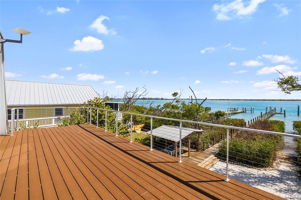 9664 Privateer Road Boca Grande, FL 33921 - Photo 39 of 66 a view of a swimming pool with seating space