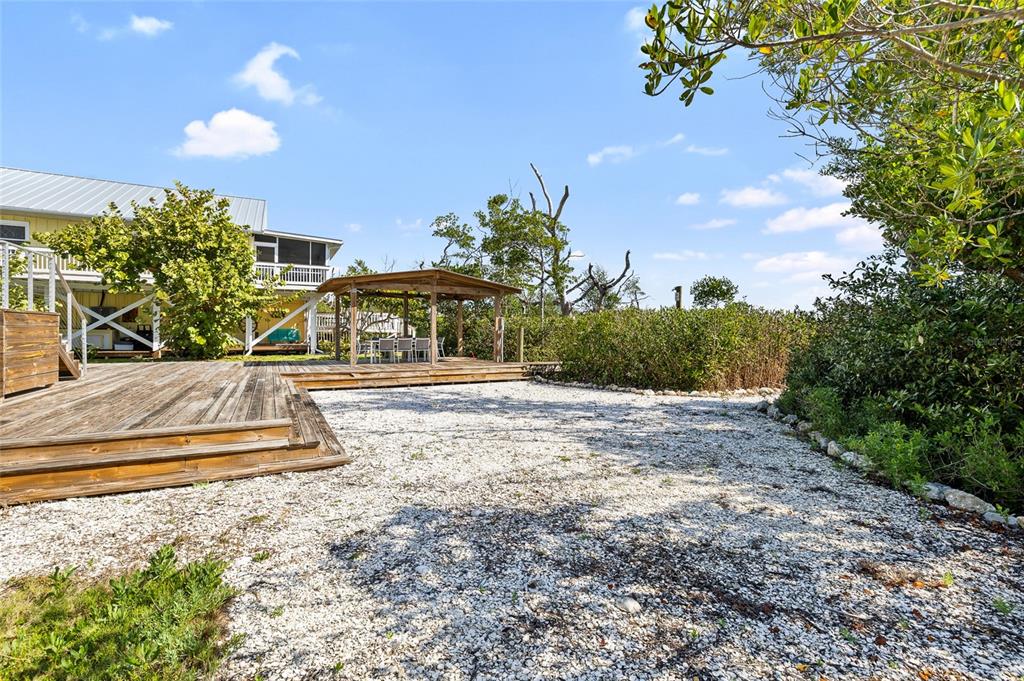 9664 Privateer Road Boca Grande, FL 33921 - Photo 50 of 66 a view of a yard