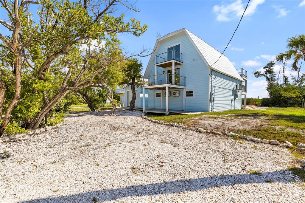 9664 Privateer Road Boca Grande, FL 33921 - Photo 51 of 66 a house view with a backyard space