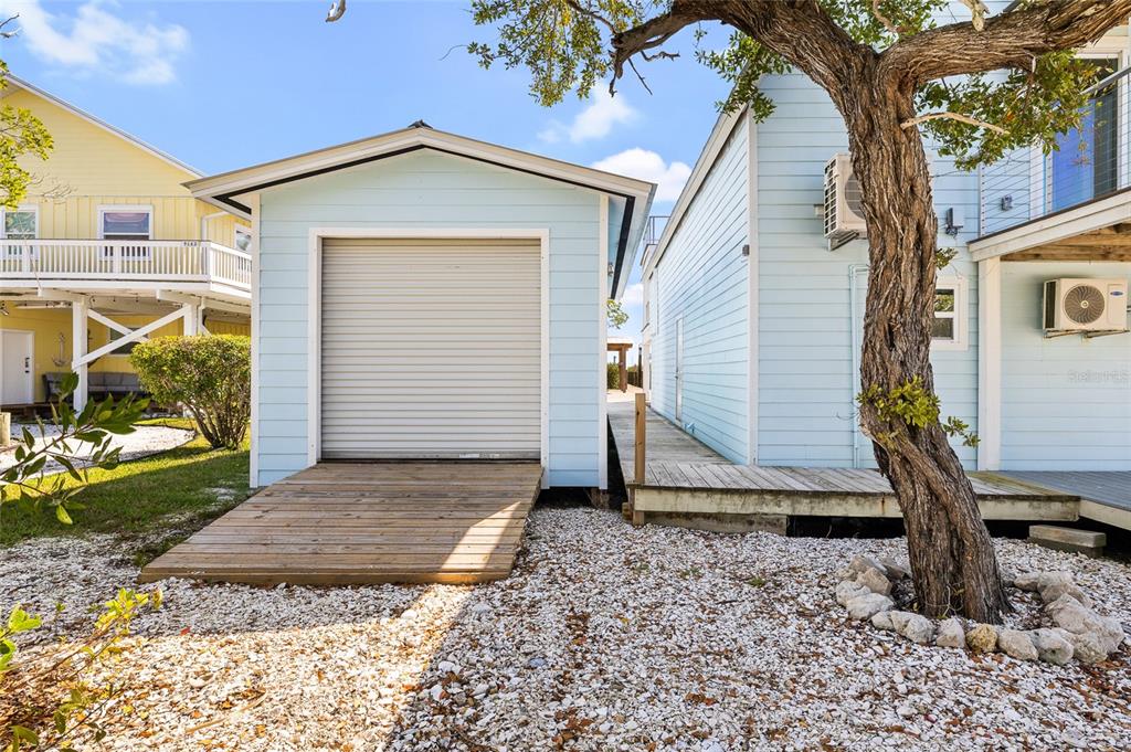 9664 Privateer Road Boca Grande, FL 33921 - Photo 55 of 66 a view of a house with backyard and garden