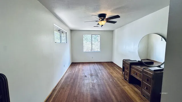 a view of workspace with wooden floor