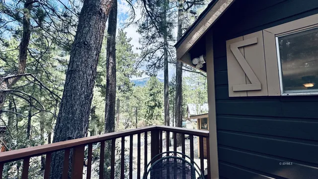 a view of a balcony with wooden floor and outdoor space