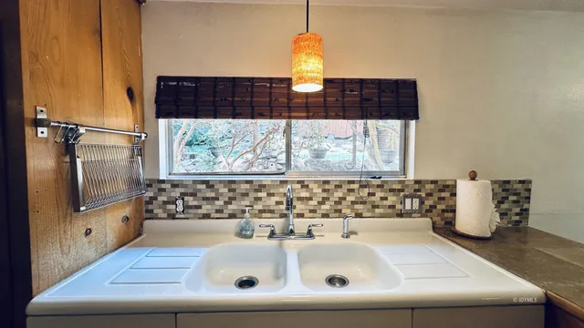 a bathroom with a sink a mirror and a bathtub