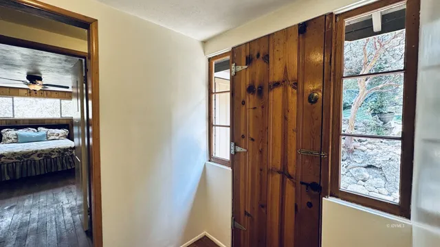 a view of a bedroom from a hallway