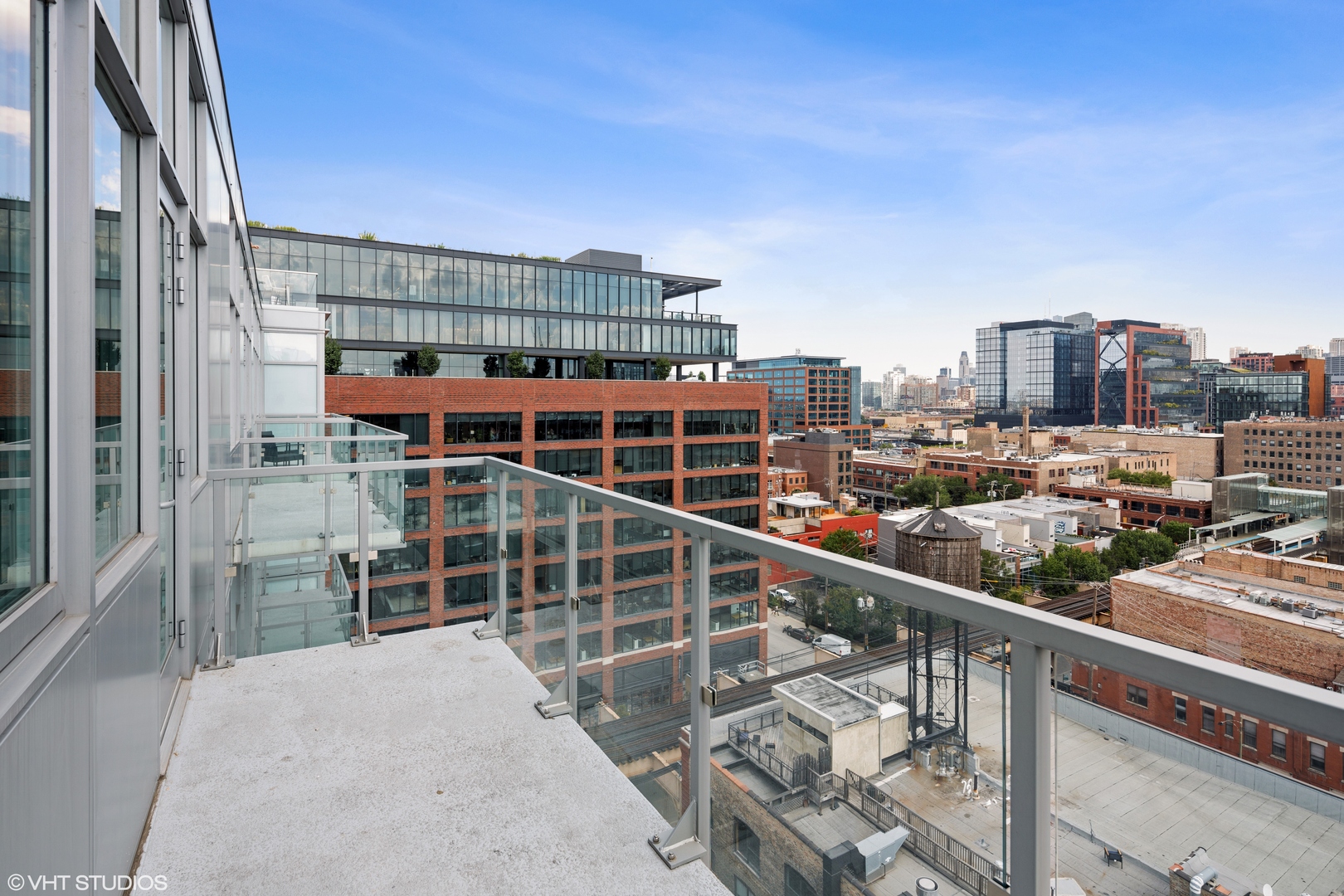 171 North Aberdeen Street, Unit 1008 Chicago, IL 60607 - Photo 13 of 25 a view of a city from a balcony