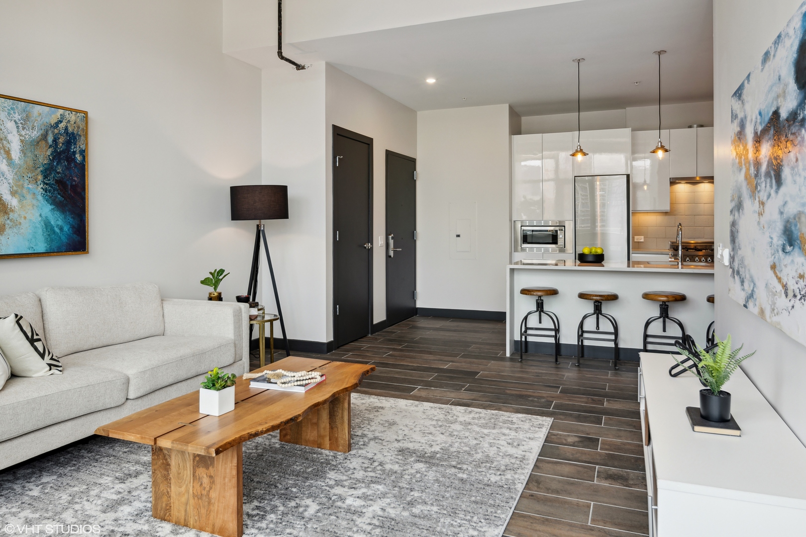 171 North Aberdeen Street, Unit 1008 Chicago, IL 60607 - Photo 4 of 25 a living room with furniture and a chandelier