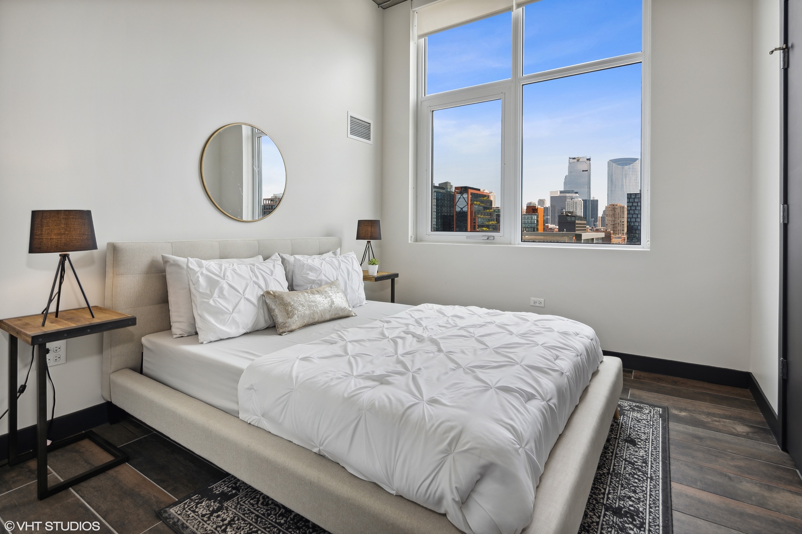 171 North Aberdeen Street, Unit 1008 Chicago, IL 60607 - Photo 8 of 25 a bedroom with a large bed and a window