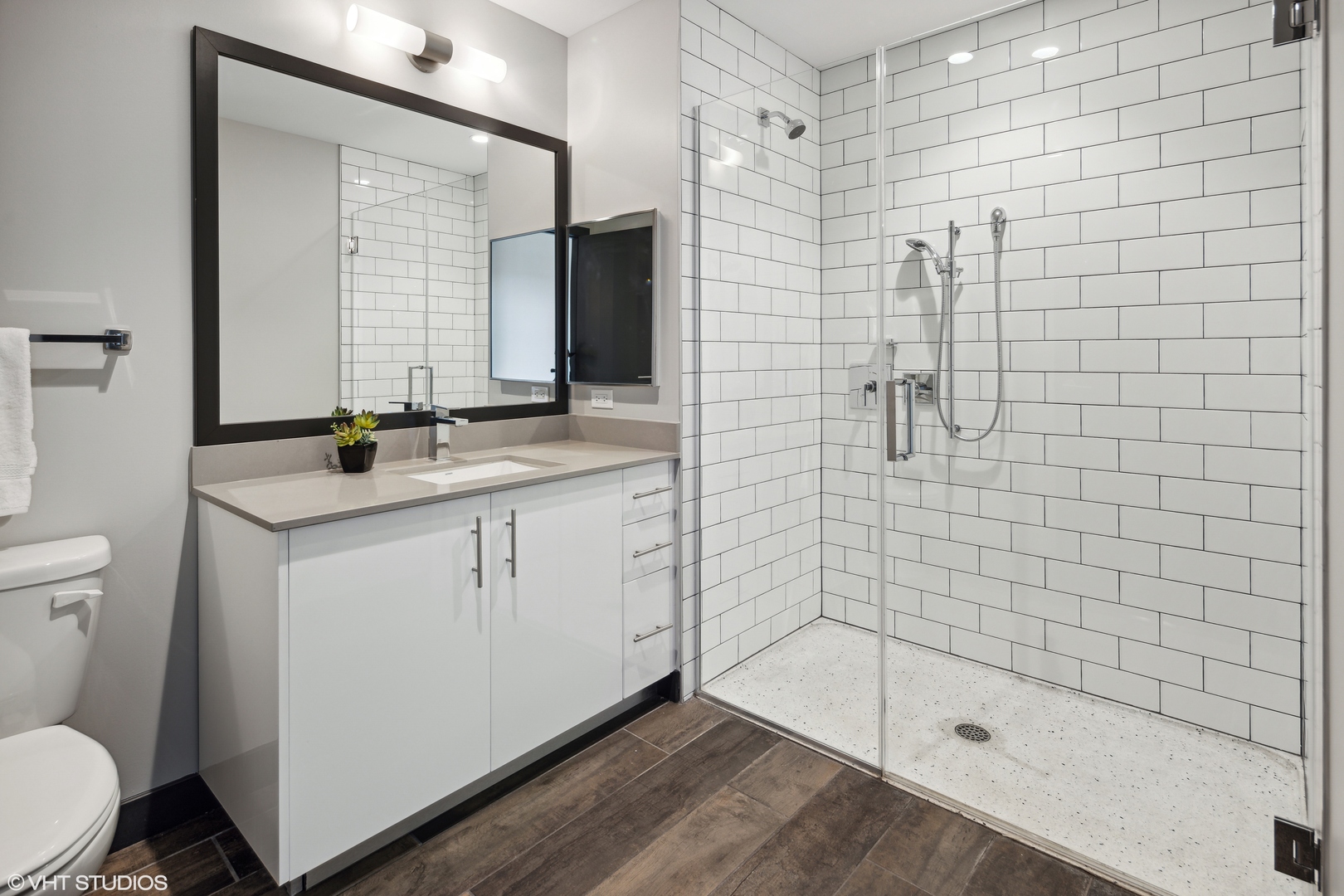 171 North Aberdeen Street, Unit 1008 Chicago, IL 60607 - Photo 9 of 25 a bathroom with a sink a toilet and shower
