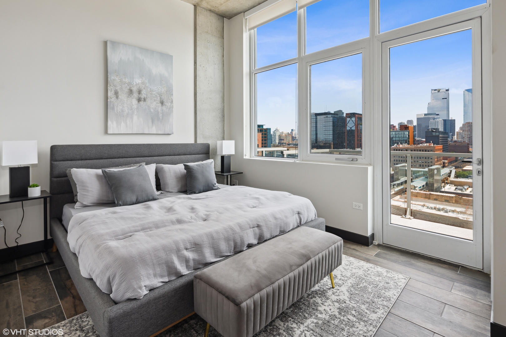 171 North Aberdeen Street, Unit 1008 Chicago, IL 60607 - Photo 10 of 25 a bedroom with a bed and glass window