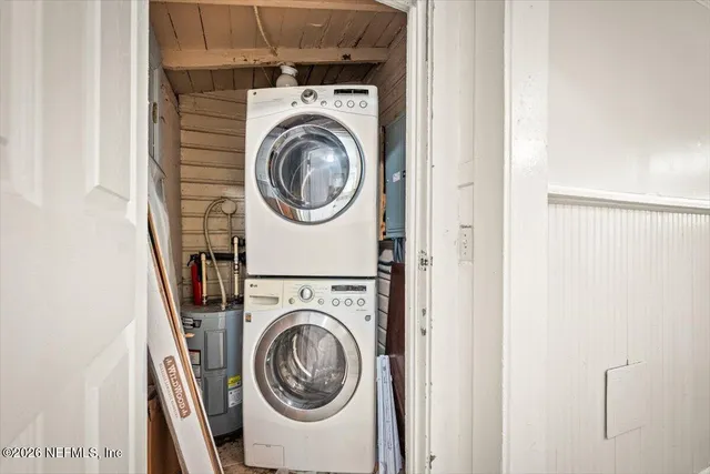a view of a hallway with washer and dryer