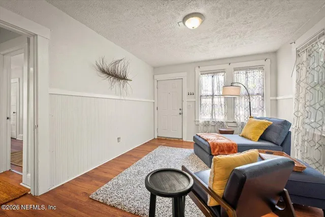 a bedroom with furniture and a window