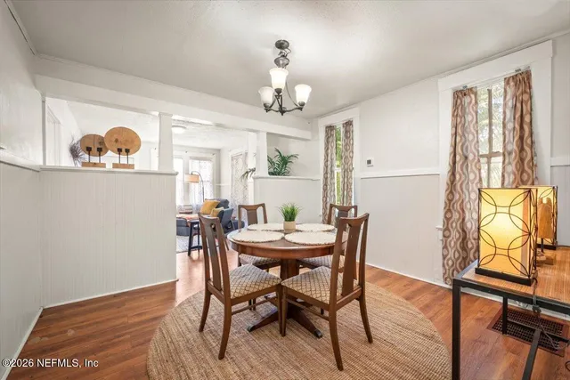 a view of a dining room with furniture window and wooden floor