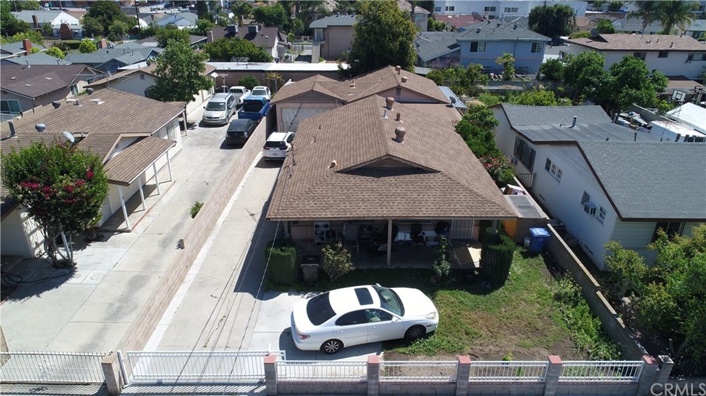 an aerial view of a house with a yard and sitting area