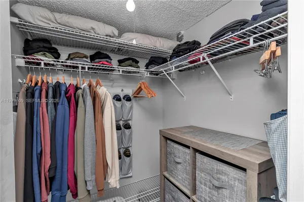a view of a closet with storage