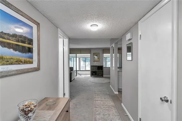 a view of livingroom with furniture and windows