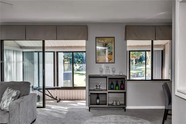 a living room with furniture and a window