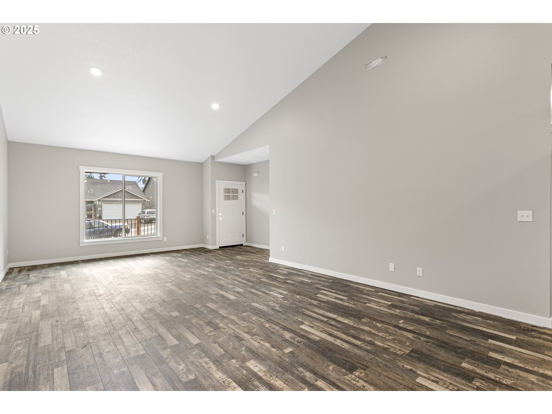 158 East H Street Vernonia, OR 97064 - Photo 2 of 33 a view of an empty room with wooden floor and a window