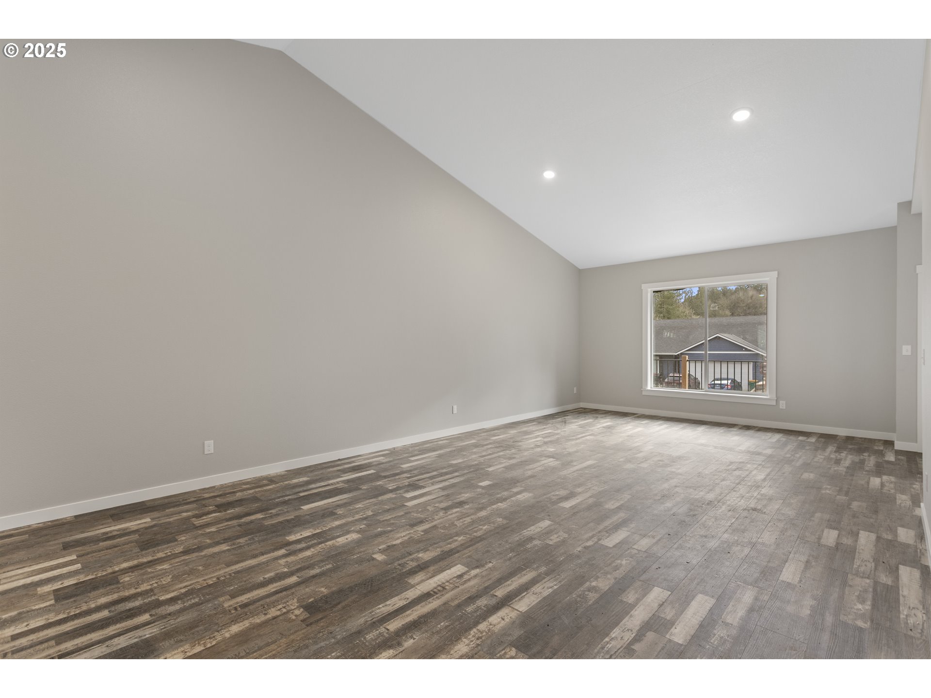 158 East H Street Vernonia, OR 97064 - Photo 4 of 33 a view of an empty room with wooden floor and window