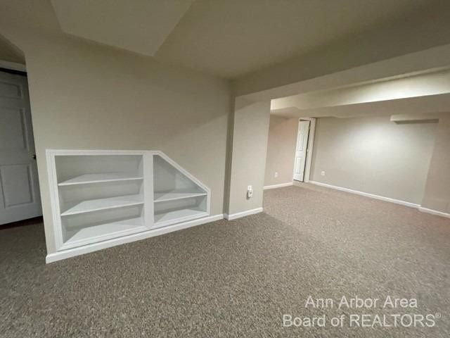 689 Glenwyth Road Brighton, MI 48116 - Photo 41 of 52 built-in shelves in basement