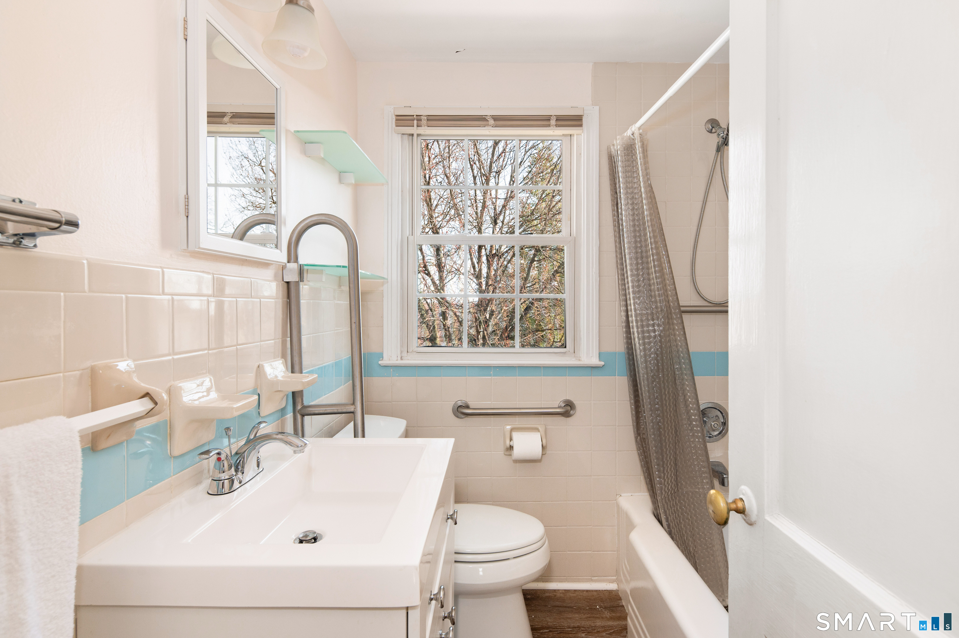 221 Sylvan Knoll Road Stamford, CT 06902 - Photo 13 of 22 a bathroom with a sink a toilet and a window