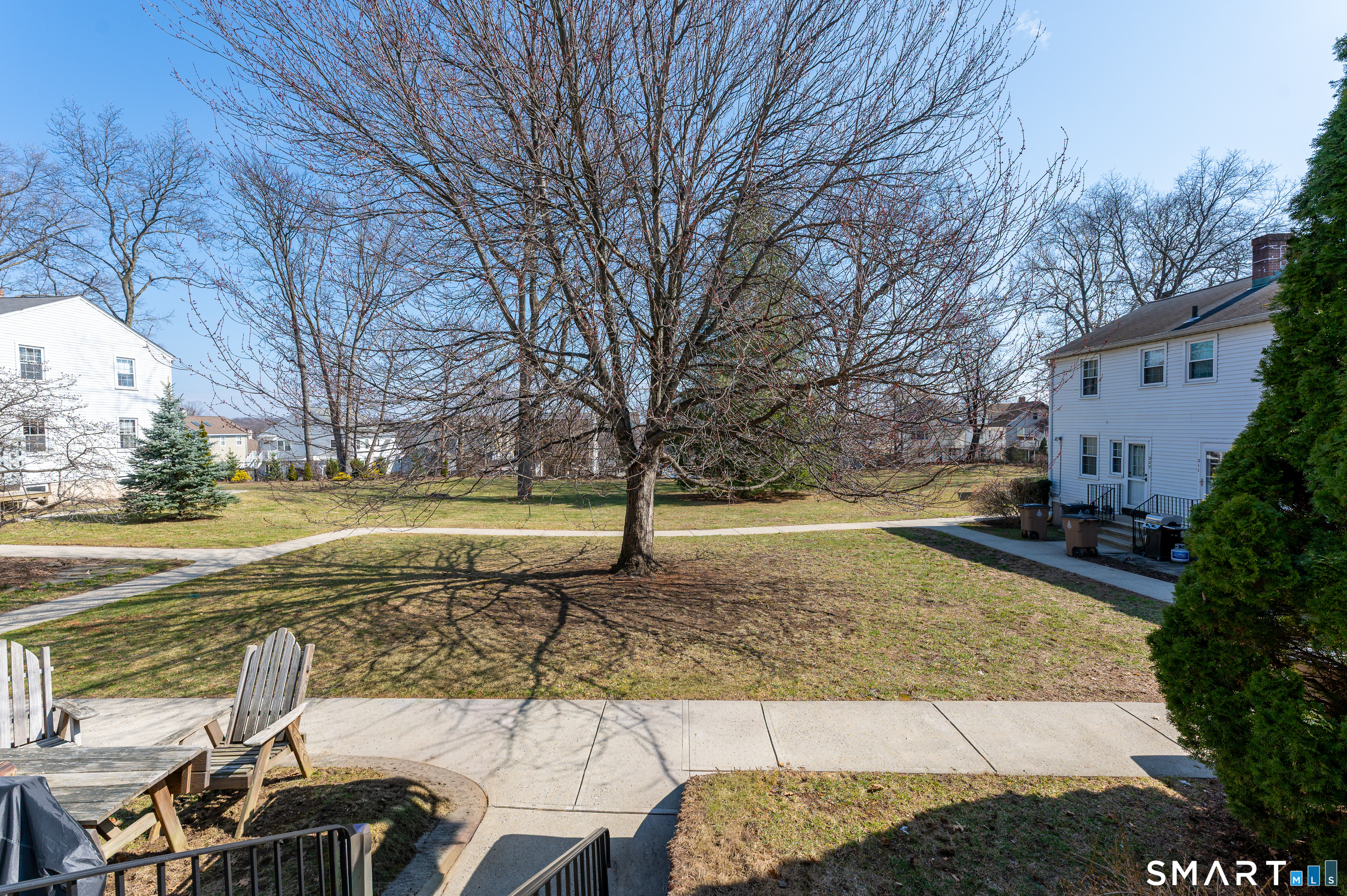 221 Sylvan Knoll Road Stamford, CT 06902 - Photo 2 of 22 a view of yard with swimming pool and trees
