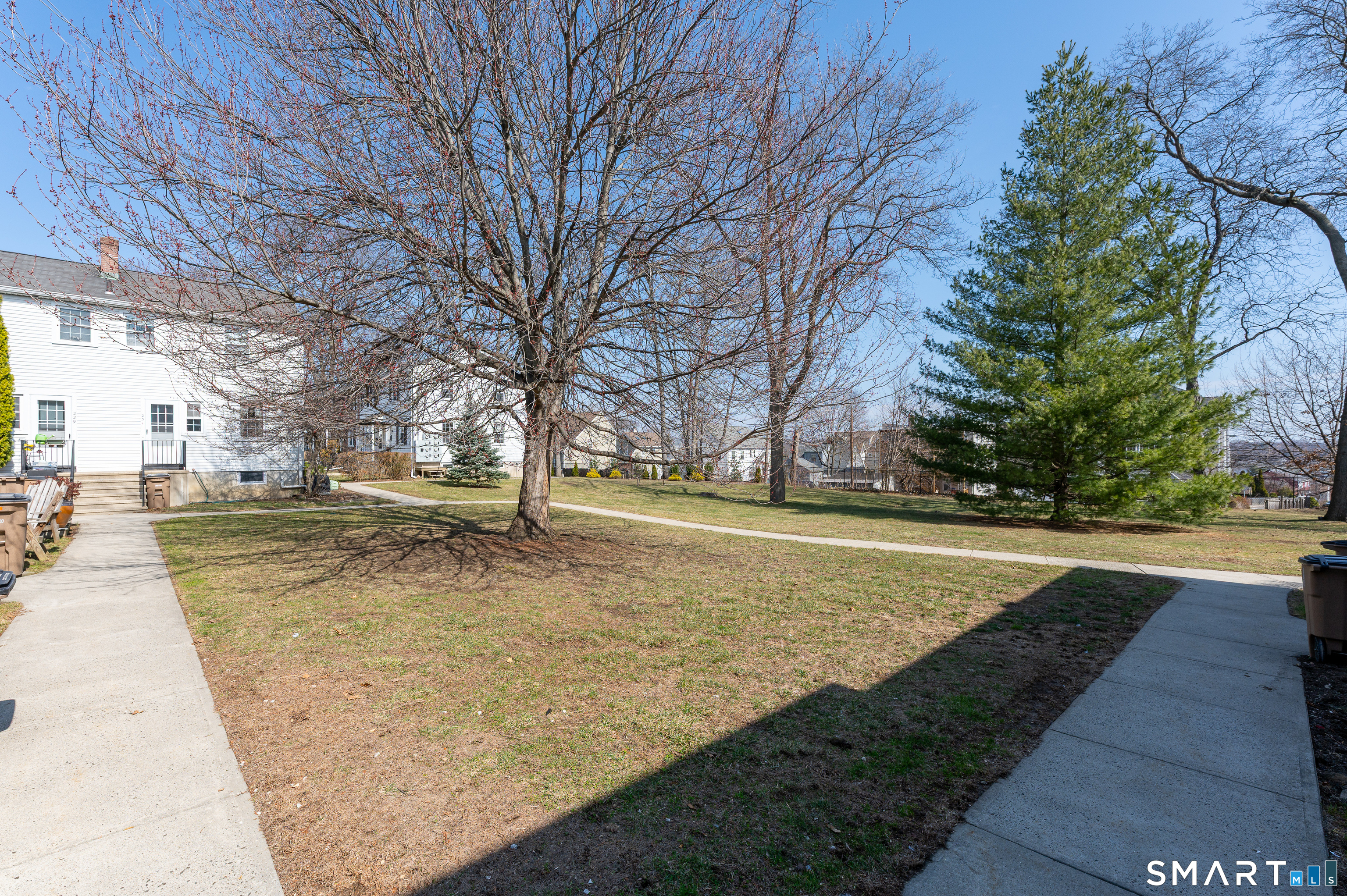 221 Sylvan Knoll Road Stamford, CT 06902 - Photo 4 of 22 a view of yard with tree s