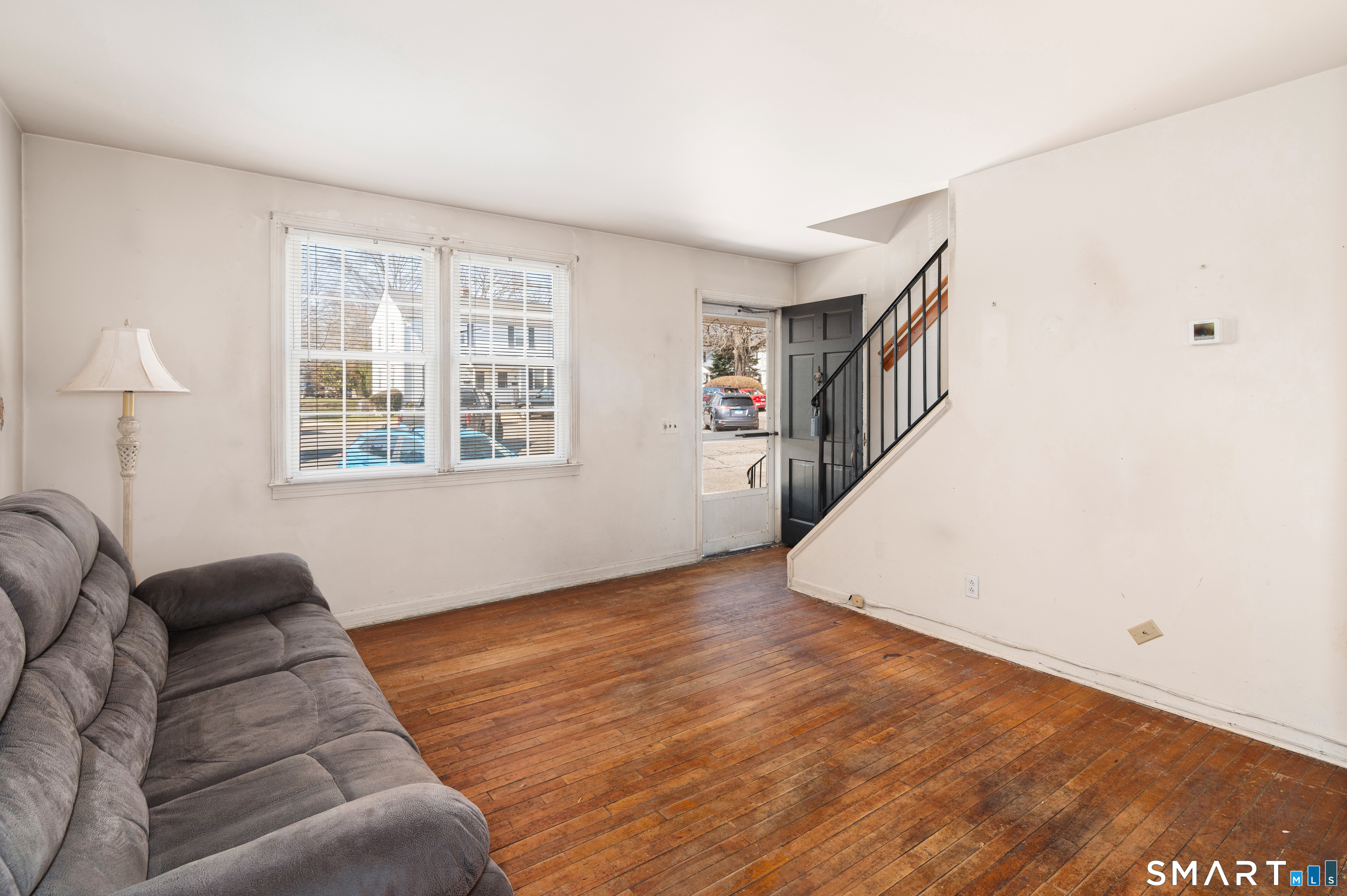 221 Sylvan Knoll Road Stamford, CT 06902 - Photo 5 of 22 a living room with furniture and a window