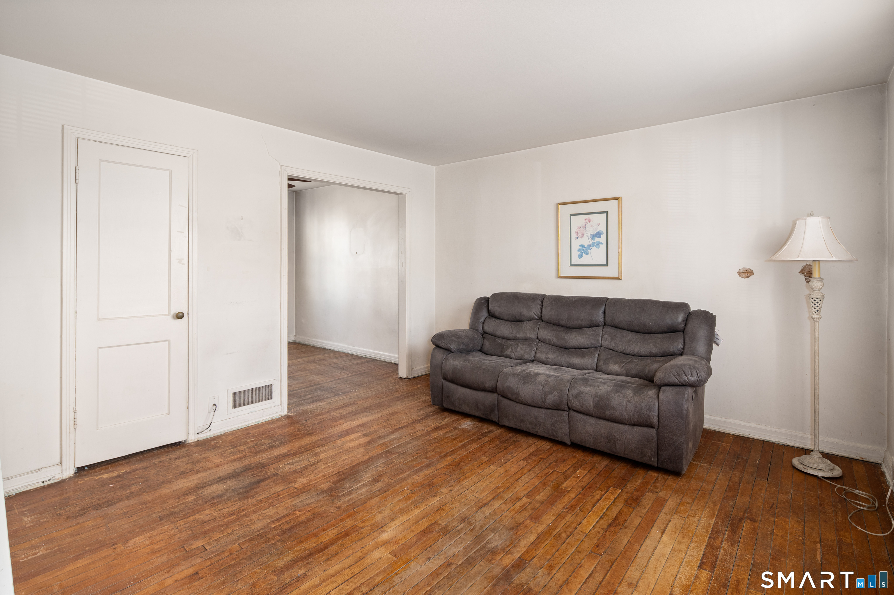 221 Sylvan Knoll Road Stamford, CT 06902 - Photo 6 of 22 a living room with furniture and a wooden floor