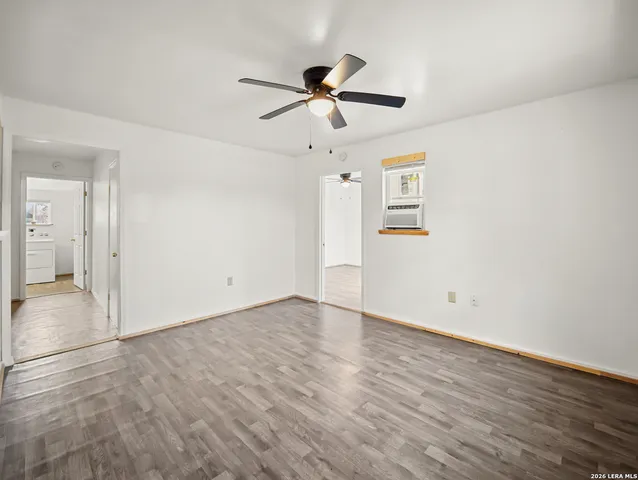 a bathroom with a toilet a sink and a mirror