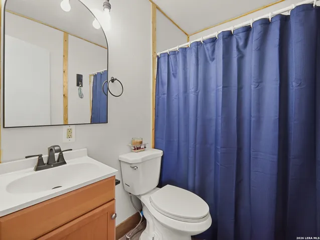 a view of a refrigerator with wooden walls