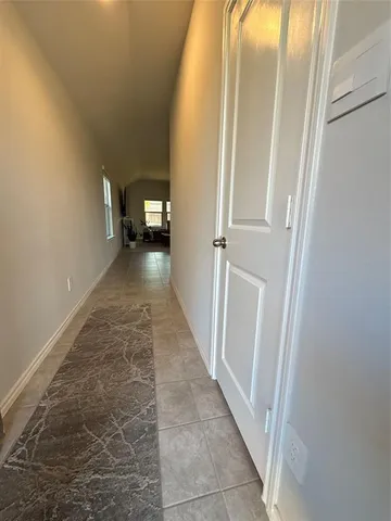 a view of a hallway view with staircase