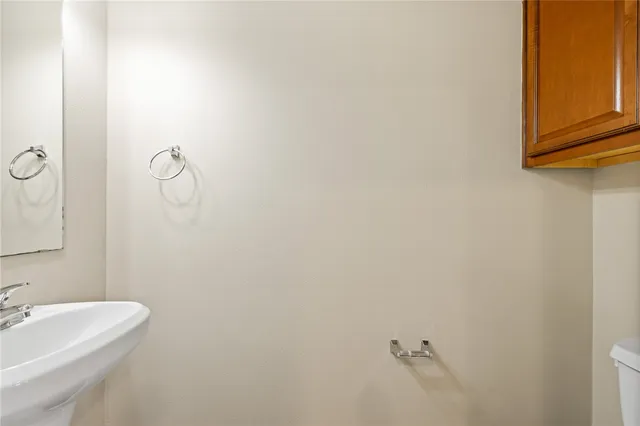 a bathroom with a sink and mirror