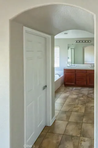 a bathroom with a mirror and a bath tub