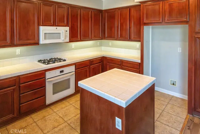 a kitchen with a sink cabinets and appliances