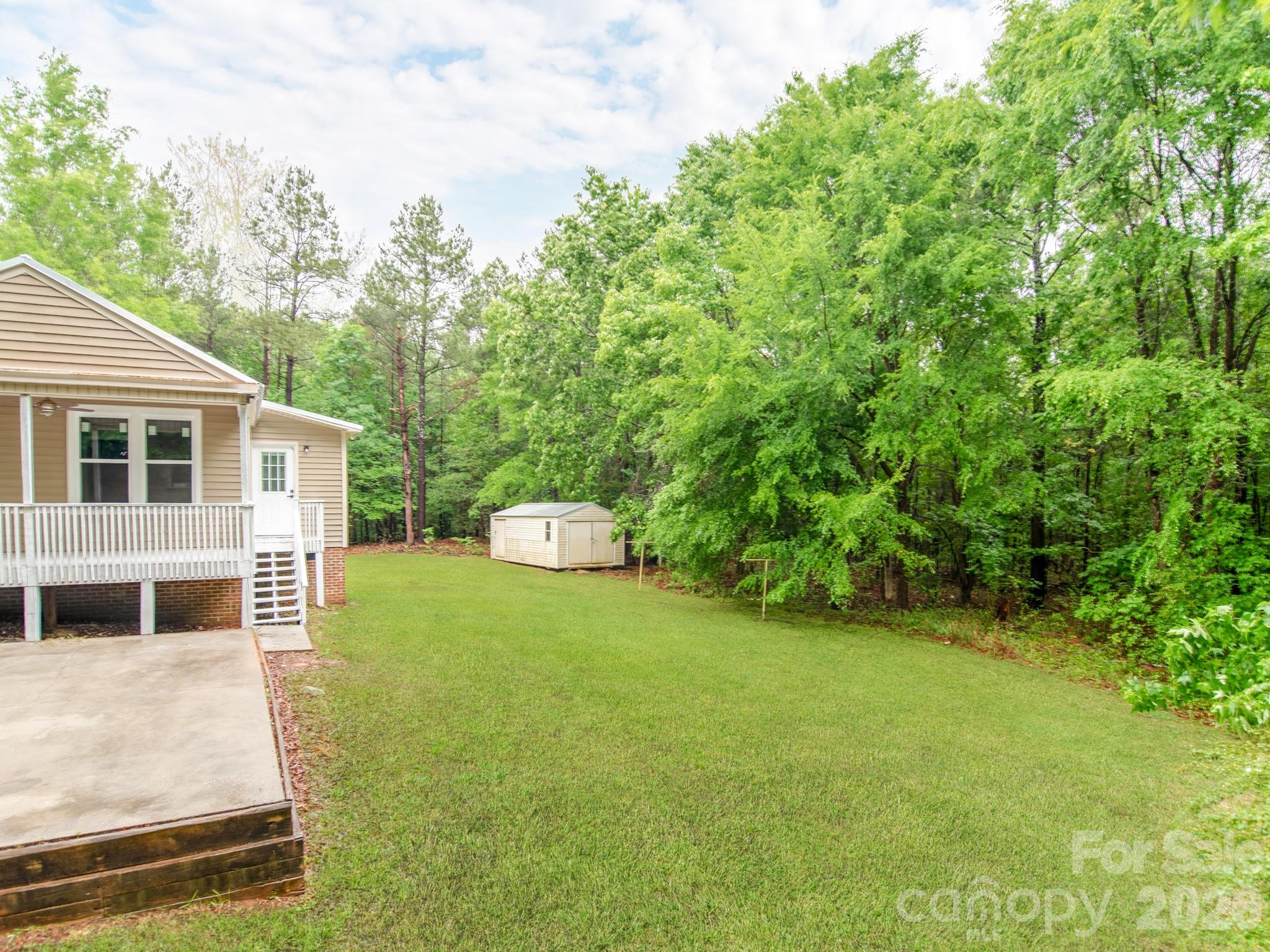 4699 Cherrystone Road Lancaster, SC 29720 - Photo 26 of 28 a view of a house with backyard and sitting area