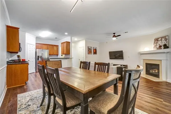 a view of a dining room with furniture and a fireplace