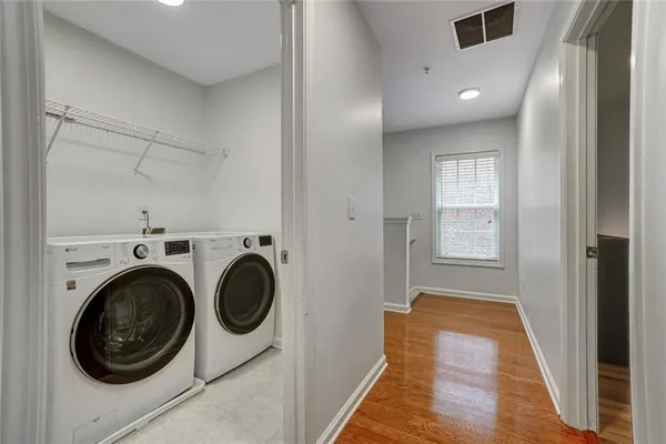 a view of a hallway with washer and dryer